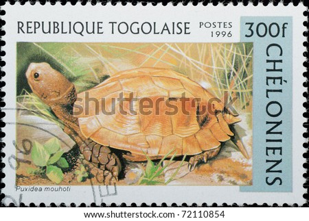 TOGO - CIRCA 1996: A stamp printed in Togo shows animal reptile turtle Puxidea mouhoti, circa 1996
