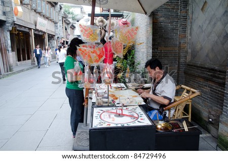 CHENGDU, CHINA-SEP 08: Shopper and stores at Jinli retro Pedestrian Street on SEP 08, 2011 in CHENGDU, China. Jinli Street is one of the most famous street of China where full of retro Chinese element