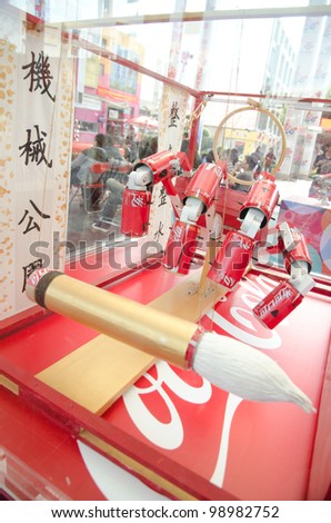 GUANGZHOU, CHINA - MAR 25: Design works on show at CocaCola Creative Design Exhibition, all works were design using wastes of Cocacola productions.  on March 25, 2012 in Guangzhou China.