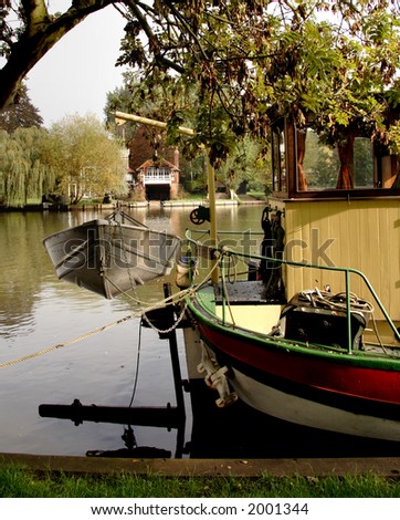 View over the River Thames across the stern of a classic Narrow-Boat