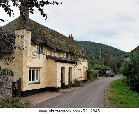 Quaint Thatched Cottage next to a Lane in Rural England