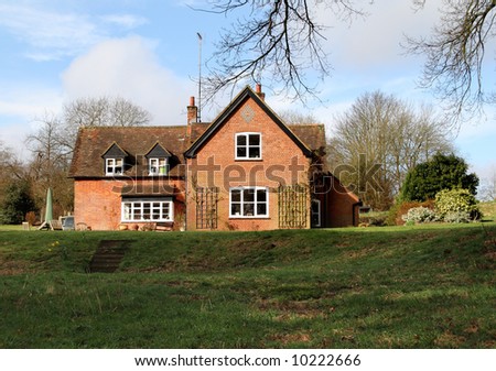 Traditional Red Brick English Rural House and garden