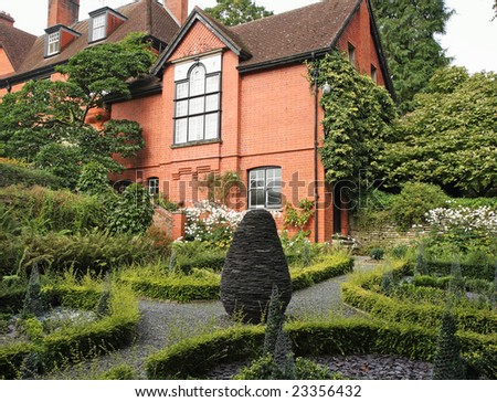 English Country House and Garden with box hedging and path