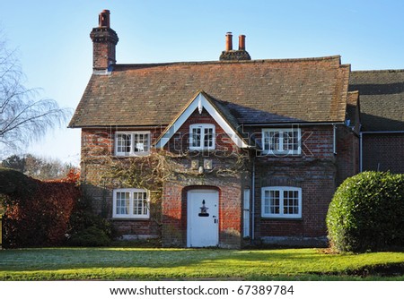 A Traditional red brick English Village House in Winter sunshine