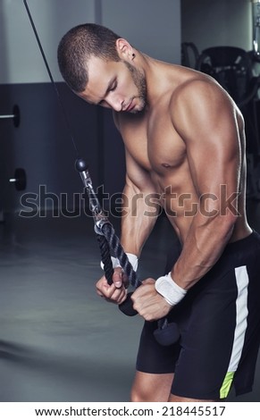 Handsome Muscular Male Model With Perfect Body Doing Triceps Exercise