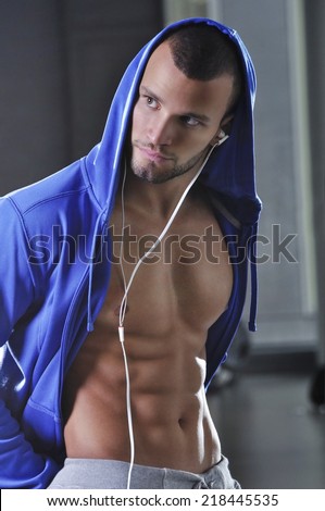 Handsome Muscular Male Model With Hooded T Shirt and Perfect Body Posing