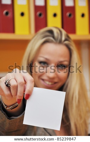 Beautiful woman showing empty paper