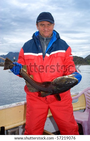 Fisherman with big fish on the boat