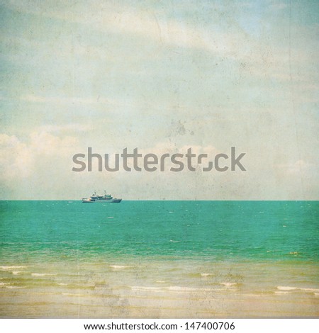 Coast of beach with fishing boat and lamp