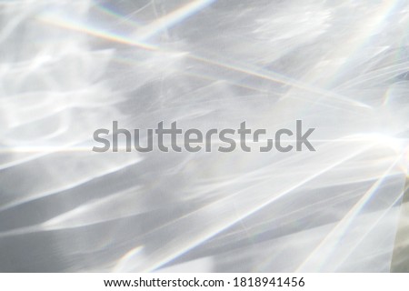Abstract water texture overlay effect, rays of light  shadow overlay effect with rainbow reflection of light from water on a white background, mockup and backdrop Foto stock © 