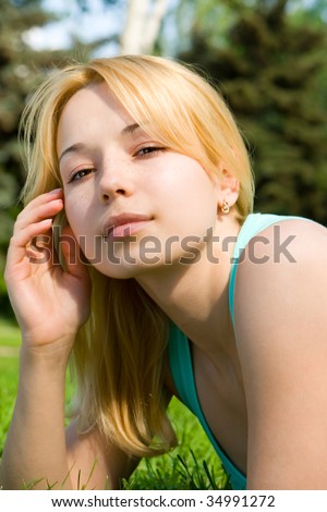 sweet woman rest on the green grass