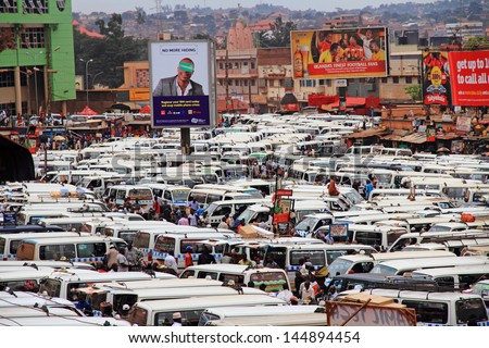 KAMPALA, UGANDA - SEPTEMBER 28, 2012.  The public transportation hub in downtown Kampala, Uganda.  Taxis (buses) wait for passengers in the large taxi park in Kampala, Uganda, on September 28, 2012.