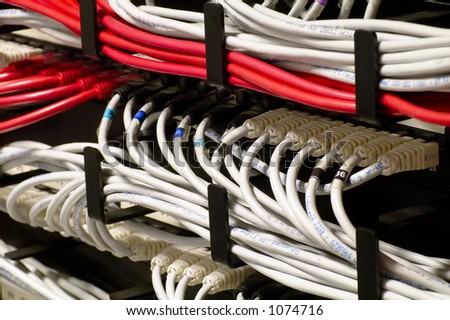 Detail of a network rack - RJ45 Cat5e cables in patch panel