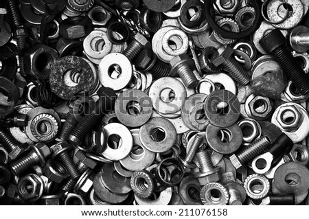 Old metal flat washers show textured background image, Black and white photo.