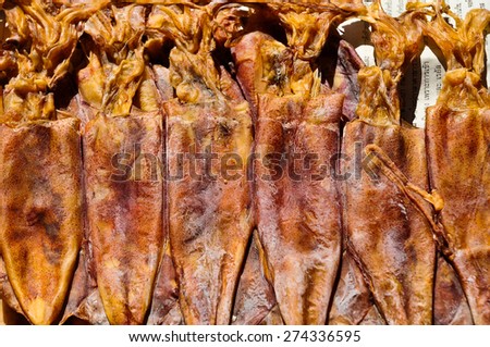 Dried squid on asian fish market for background