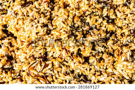 Processed rice grains background, mixed with different grains.