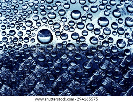 Shape of water drop is overlay with blue leather texture, abstract background