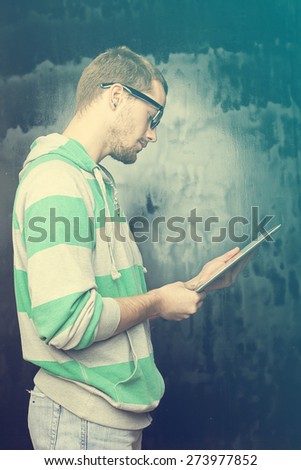 Good Looking Young Nerd Smart Guy Man Using Tablet Computer