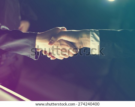 Handshake Handshaking light and dark