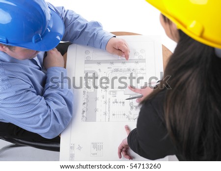 Two architects with helmet on meeting