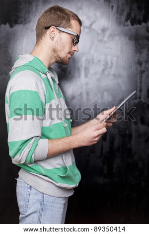 Good Looking Young Nerd Smart Guy Man Using Tablet Computer