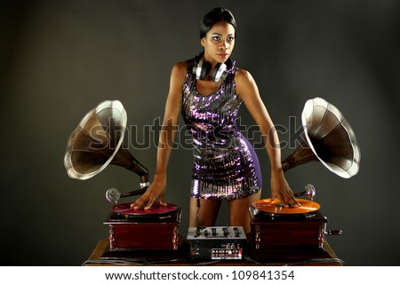 sexy young woman djs using two retro antique gramophones. cool and quirky concept clip