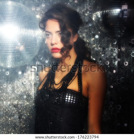 beautiful dancing woman in disco/nightclub setting