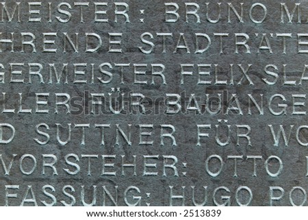 german words engraved on a plaque on building