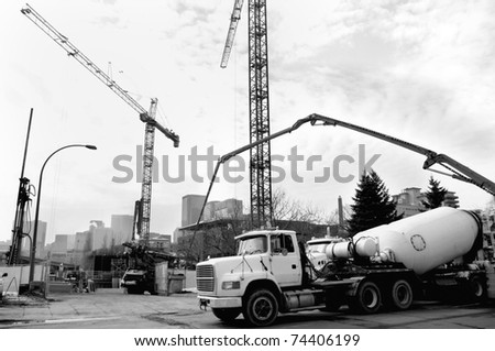 engineering industrial machinery in urban inner city setting with derricks in the sky