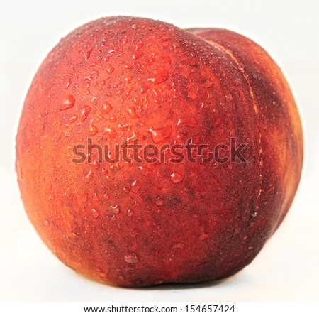 Nectarine of red color with water drops horizontal point view