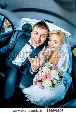 funny wedding couple in car - Stock Image - Everypixel
