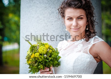 close-up portrait of a pretty shy bride on the outdoor