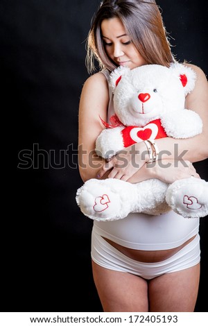 pregnant woman with a bear