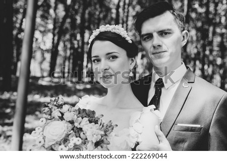 young wedding couple, beautiful bride with groom portrait on the bridge, summer nature outdoor