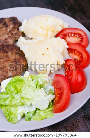 Typical Polish dinner -potato, meat, salad