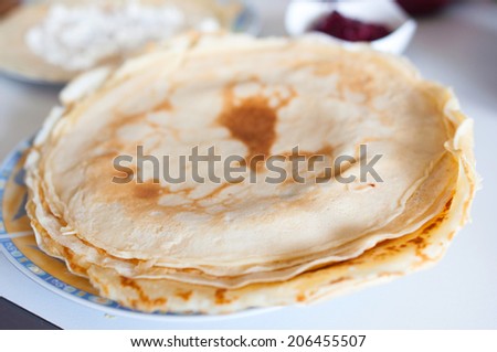 homemade pancakes with cottage cheese and fruit sauce in natural light