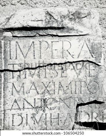 Roman inscription on marble in archaeological site