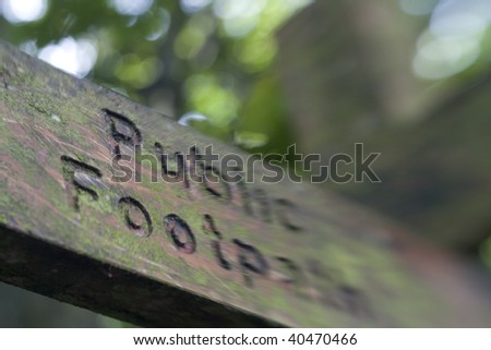Public Footpath Sign post shot at angle with selective focus.