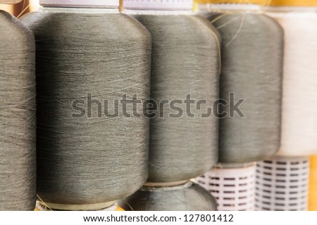 Gray silk thread roll in silk spool