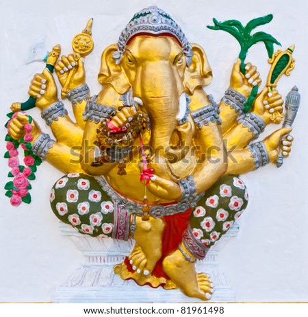 Golden Six Hands Ganesha With Weapons In Hands On White Wall Stock ...