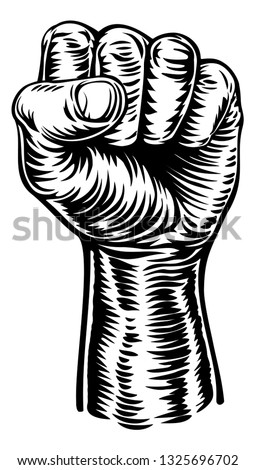 A hand in a fist raised in the air in a vintage intaglio woodcut engraved or retro revolution propaganda style Stockfoto © 