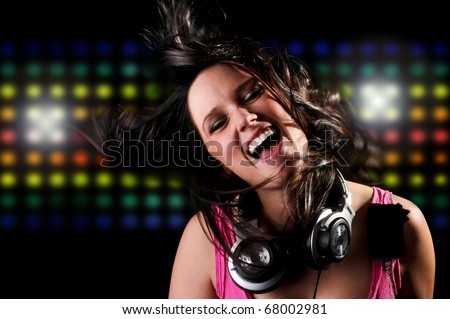 Beautiful DJ Girl Singing and Dancing with Club Lights in the background