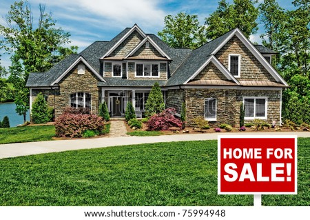 Beautiful Home with For Sale Sign in Front Yard