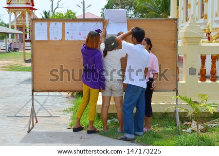 MAHASARAKHAM, THAILAND - APRIL 22 : Unidentified voters search names list and go to vote for village headman election on April 22, 2013 in Ban Nong Weang, Muang, Mahasarakham, Thailand.