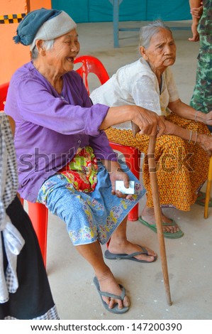 MAHASARAKHAM, THAILAND - APRIL 22 : Unidentified old women sit and wait to vote for village headman election on April 22, 2013 in Ban Nong Weang, Muang, Mahasarakham, Thailand.