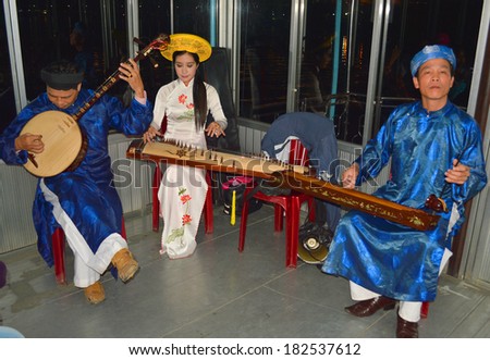 HUE CITY, VIETNAM - MARCH 15 : Musicians are singing and performing in night romance show at The Perfume River on March 15, 2014 in Hue city, Vietnam.