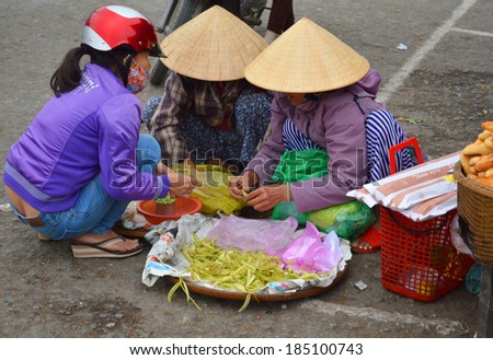 HUE, VIETNAM - MARCH 15 : Merchants are selling foods and fruits at Dong Ba market on March 15, 2014 in Hue, Vietnam. Dong Ba is the biggest market in Hue, Vietnam.