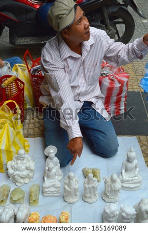 HUE, VIETNAM - MARCH 15 : Merchant is selling souvenirs at Dong Ba footpath market stall on March 15, 2014 in Hue, Vietnam. Dong Ba is the biggest market in Hue, Vietnam.