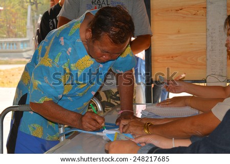 MAHASARAKHAM - JANUARY 29 : Disabled old man goes to vote for village headman election at Ban Nong Hin on January 29, 2015 in Muang, Mahasarakham, Thailand.