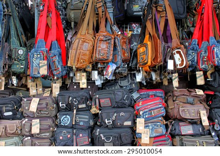 MUKDAHAN - JUNE 19 :  Bags from China and Vietnam in business center at Indo-China market on June 19, 2013 in Mukdahan, Thailand.